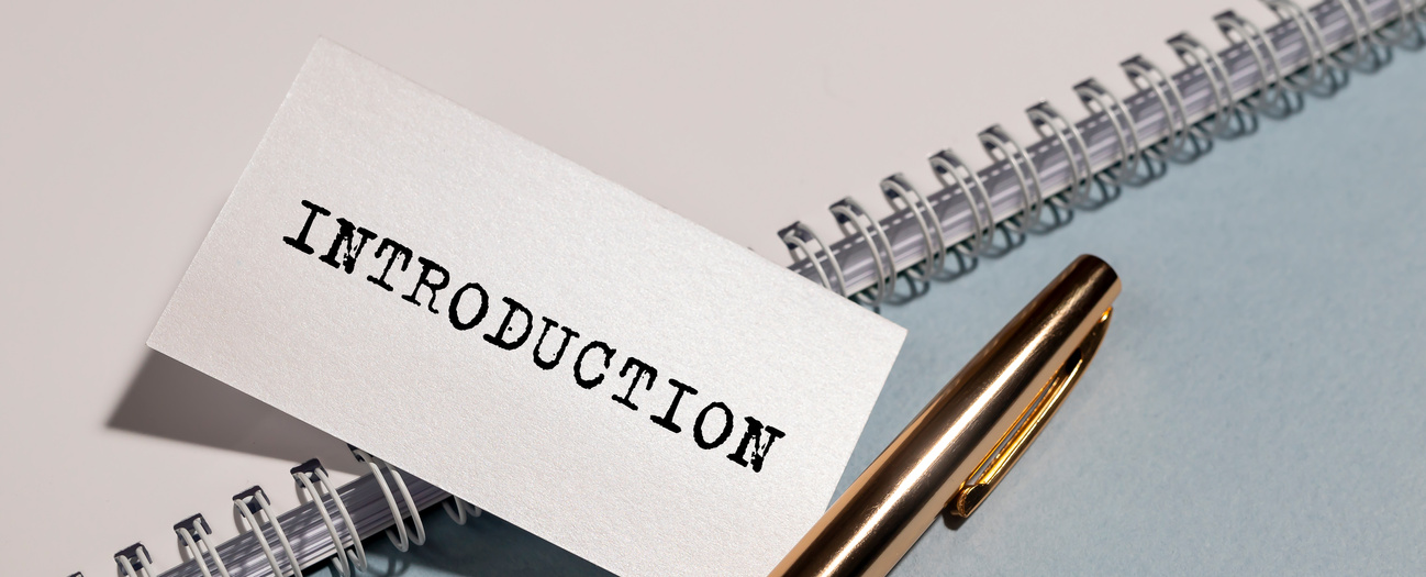 Word INTRODUCTION on paper on office desk